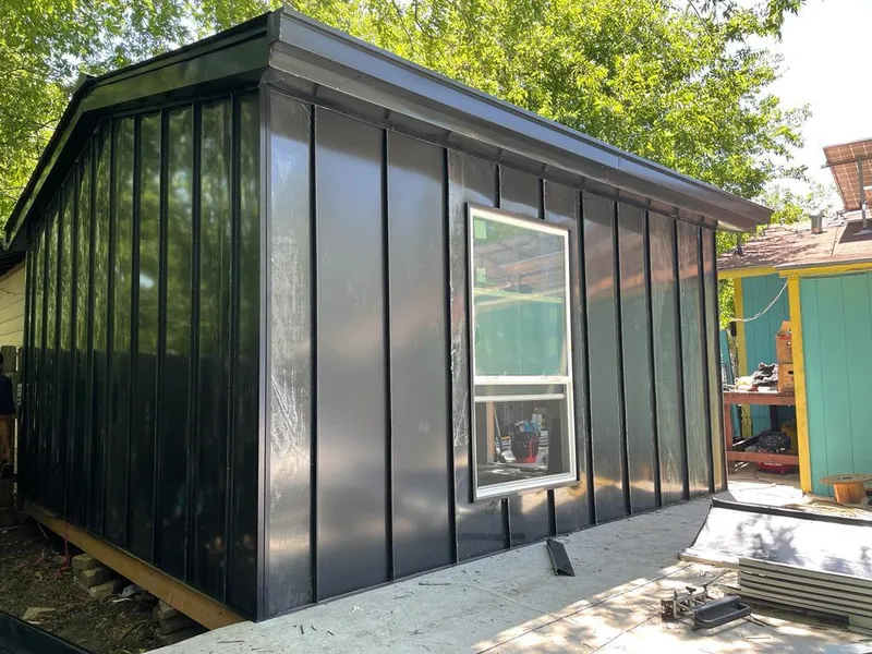 Black standing seam metal wall panels for Metal Roof Installation in Tuttle