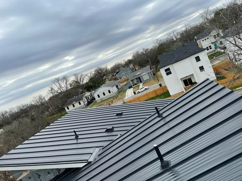 Standing seam metal roof panels with vents for Skylight Repair in Tuttle